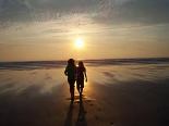 Couple Walking On Beach